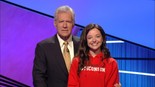 Julia Sprangers ’13 poses with host Alex Trebek during the taping of the 2013 Jeopardy! College Championship.