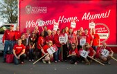Alumni volunteers have a long-standing tradition of walking together in the Homecoming parade, representing all the areas of the country that are populated with UW grads.