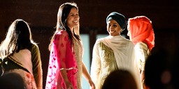 A student beaming in her traditional garb from Bangladesh.