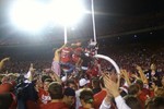 fans storming the field at Camp Randall