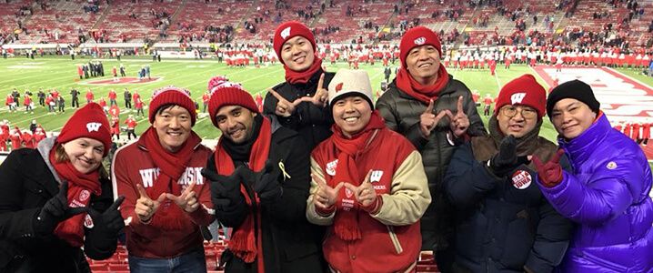 Jemmy Chayadi and friends at Badger football game.