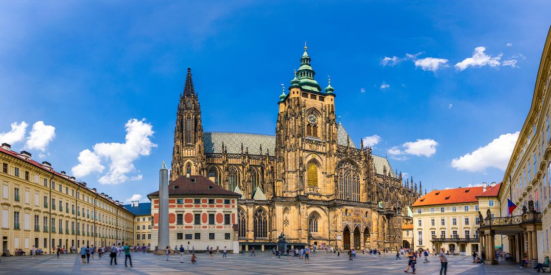 A town square with a cathedral in Europe