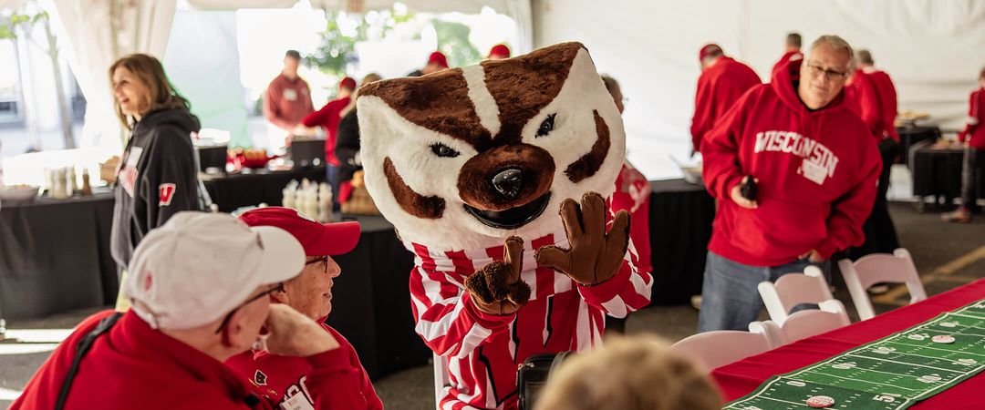 2025 WFAA Tailgate; Bucky shown interacting with attendees.