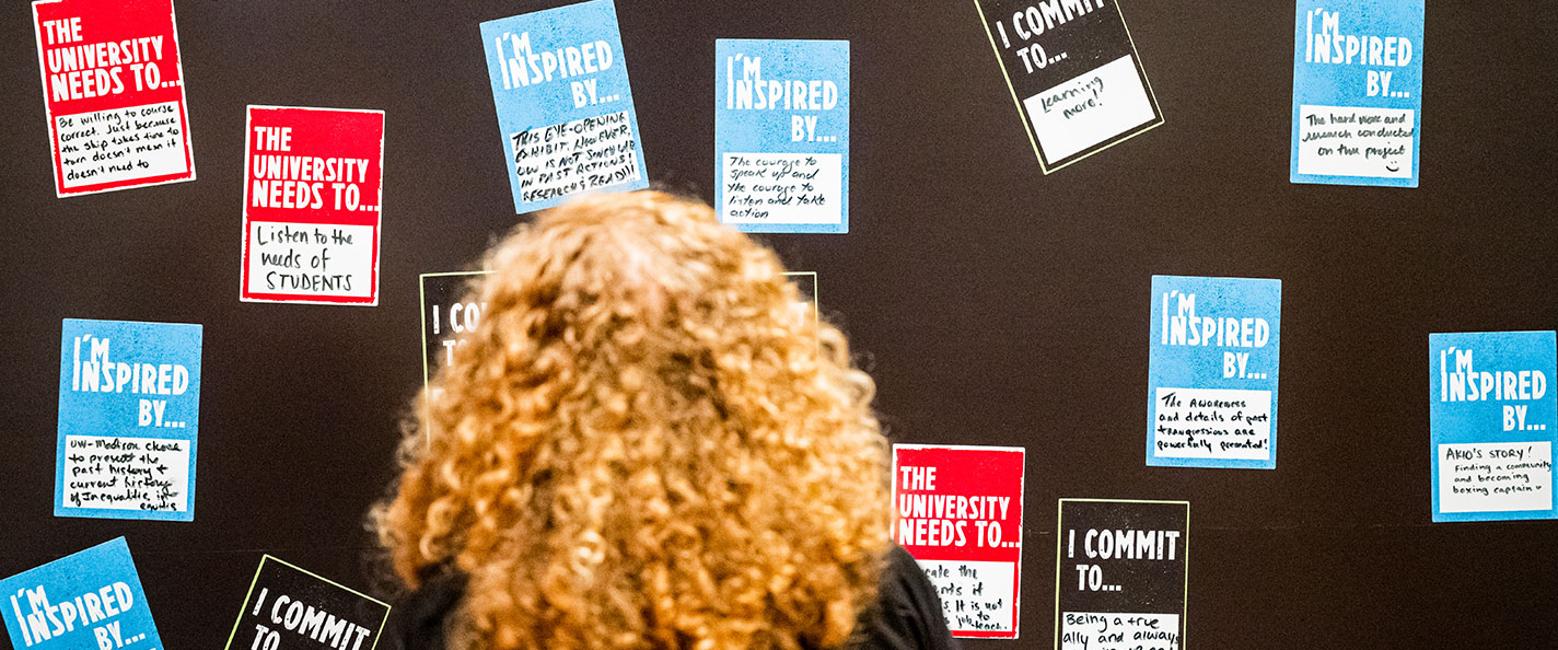 Chancellor Mnookin in front of Public History Project exhibit