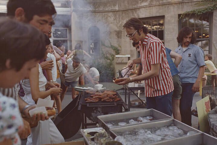 A group of people grabbing food