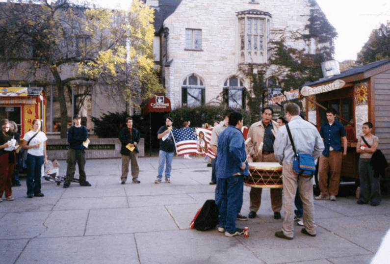 Members of Wunk Sheek beat drums at an anti-Columbus Day rally in 2000 on Library Mall