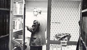 Black and white photo of Memorial Library study cages.