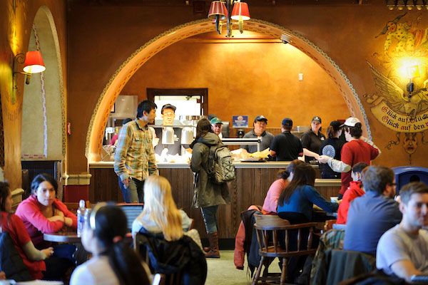 ON JAN. 24, 2012, PATRONS COLLECT THEIR MADE-TO-ORDER FOOD FROM A PICKUP COUNTER AT THE NEWLY RENOVATED DER RATHSKELLER IN THE MEMORIAL UNION. (PHOTO BY JEFF MILLER / UNIVERSITY COMMUNICATIONS)