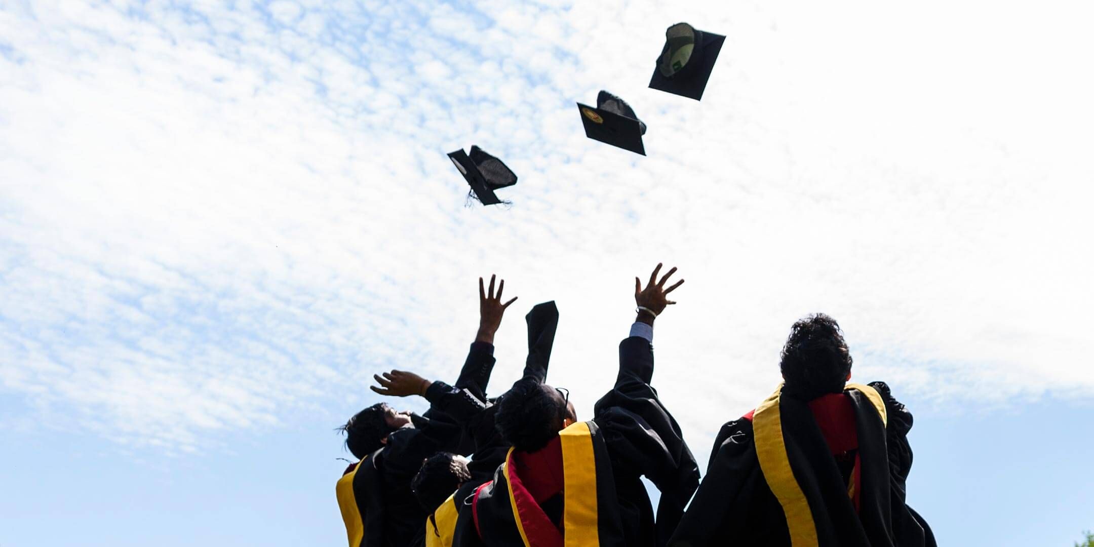 Grads tossing their caps