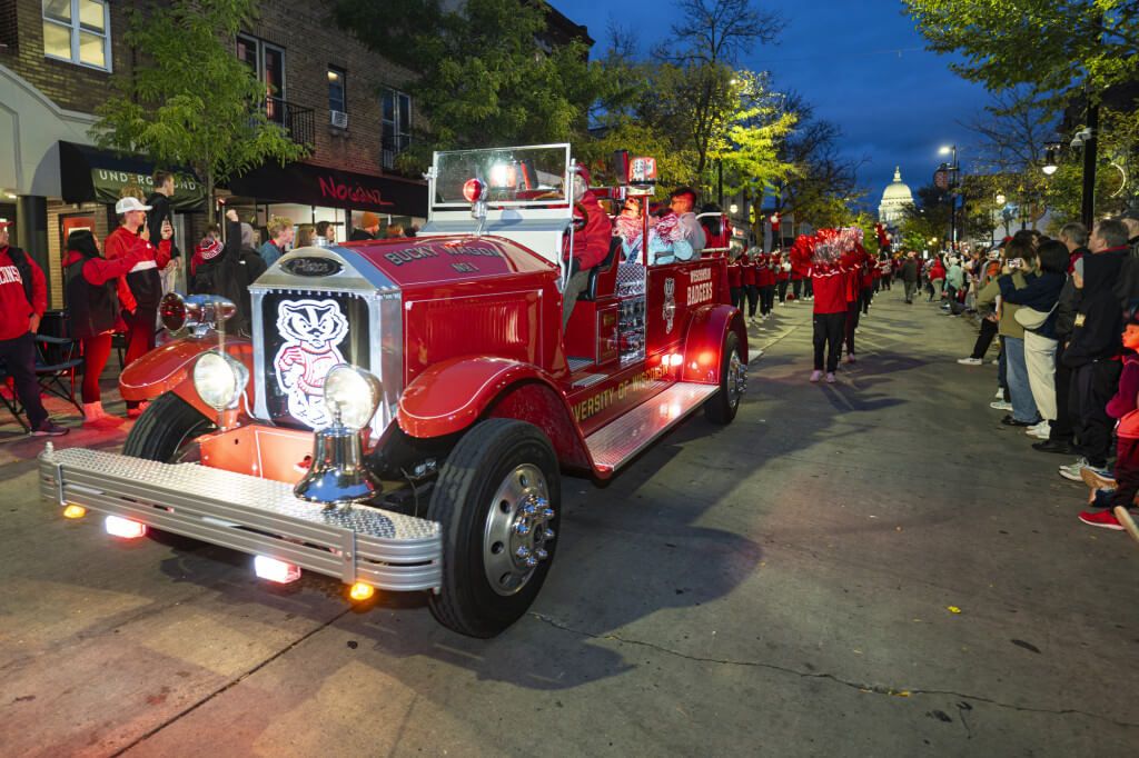 The Red Wagon cruises down State Street during the Homecoming Parade.