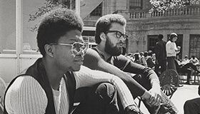 Two students enjoying the view of the lake from the Memorial Union Terrace