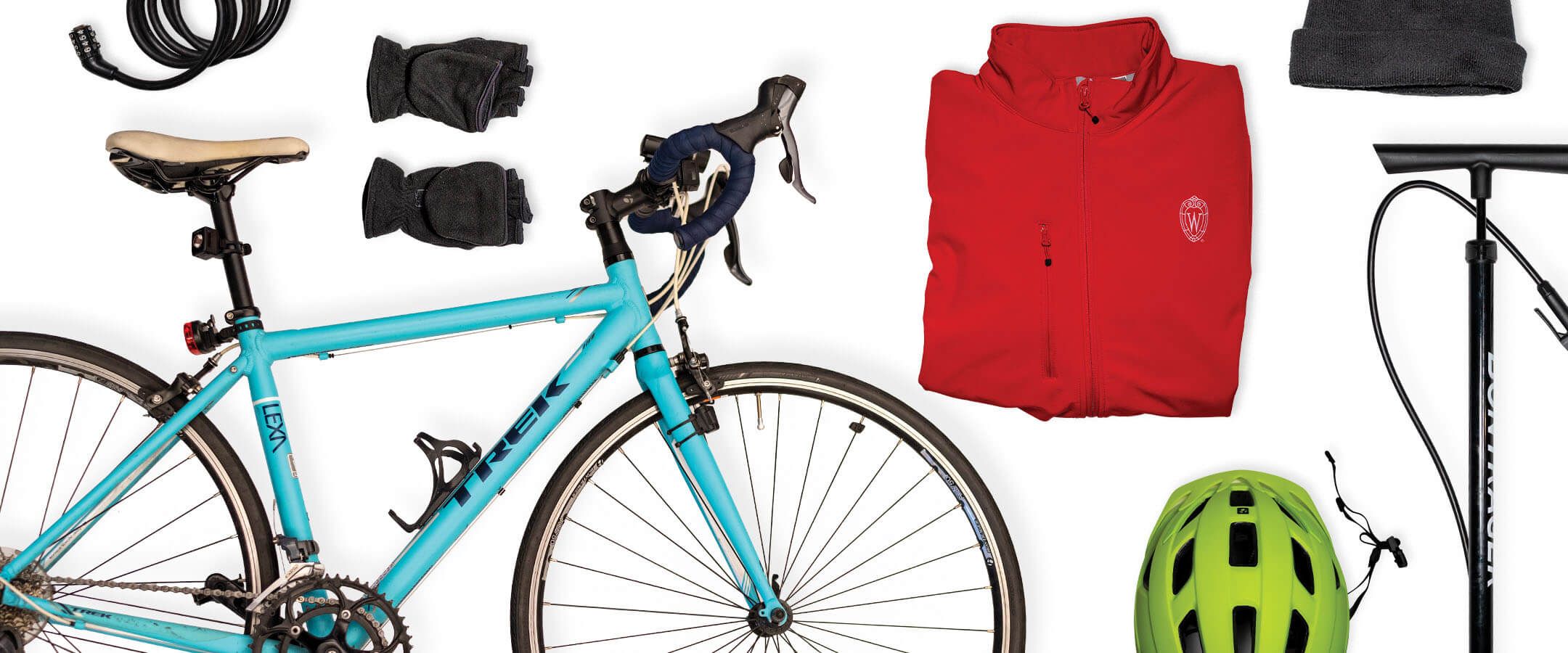 An assortment of bicycle equipment is displayed against a white background. The collection includes a light-blue bike, a red windbreaker, a neon-yellow helmet, a floor pump, gloves, a lock, and a knit hat.