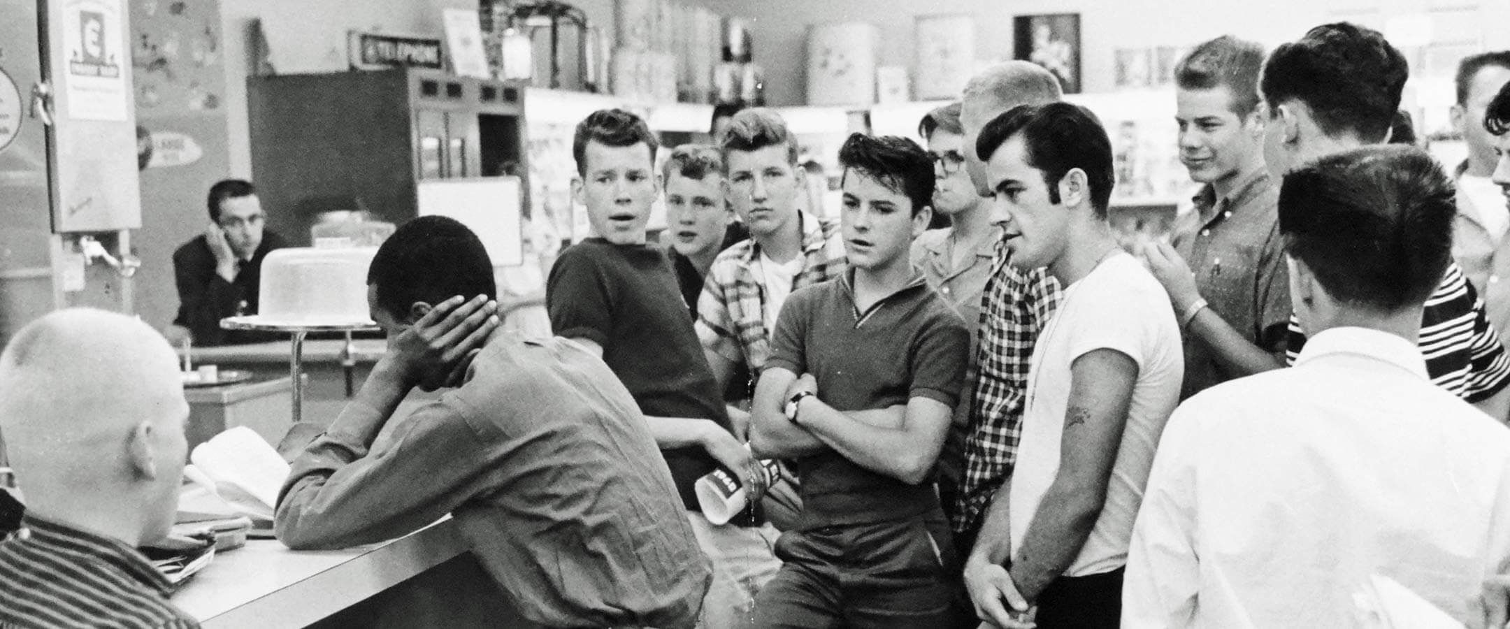 Diamond is accosted by a hostile mob at a 1960 drugstore sit-in. DC Public Library, Star Collection © Washington Post
