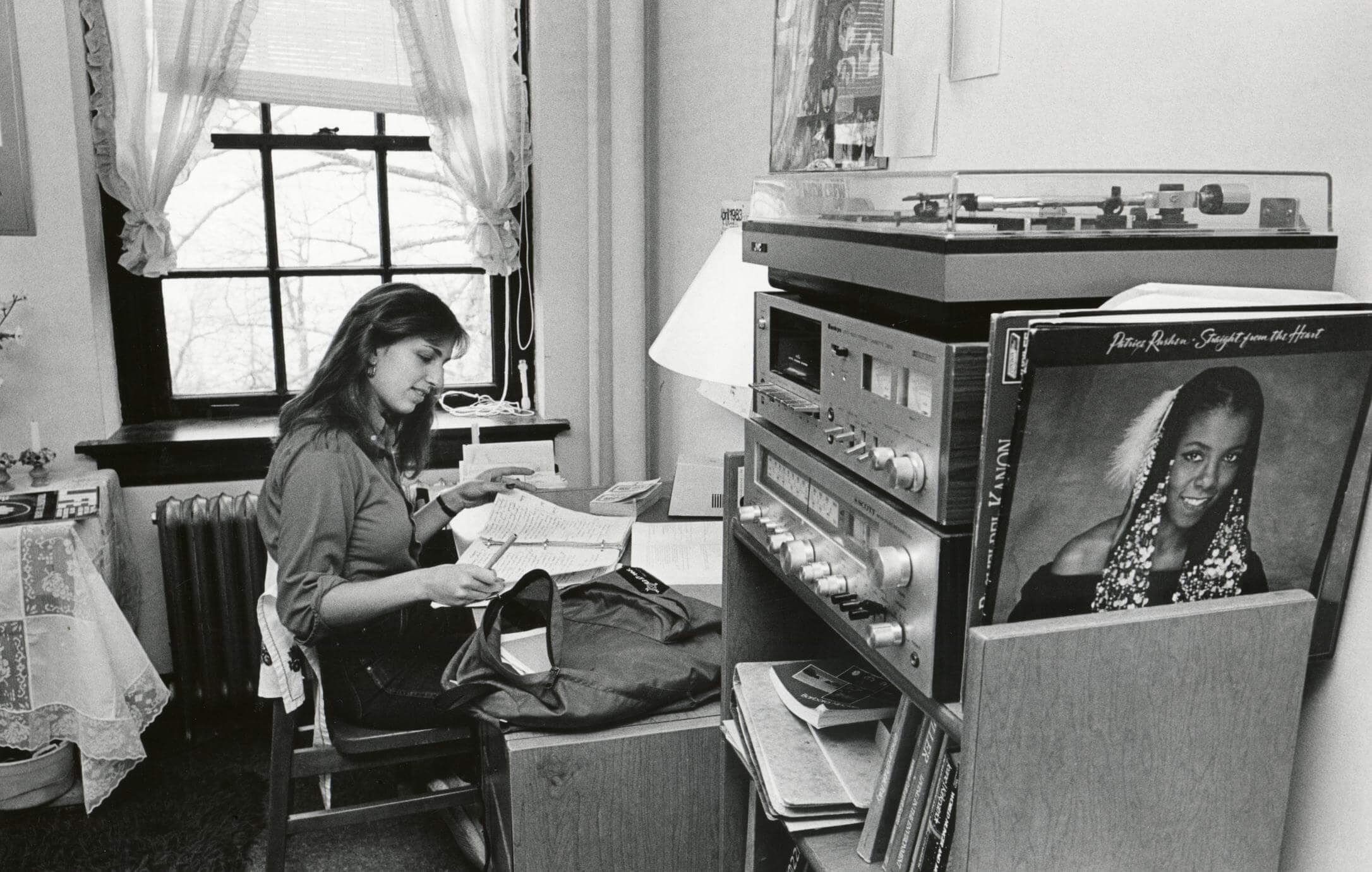 Student studying in a dorm.