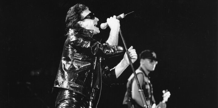 U2 performing on stage.