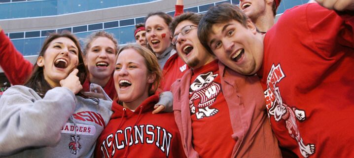 Football fans cheering.